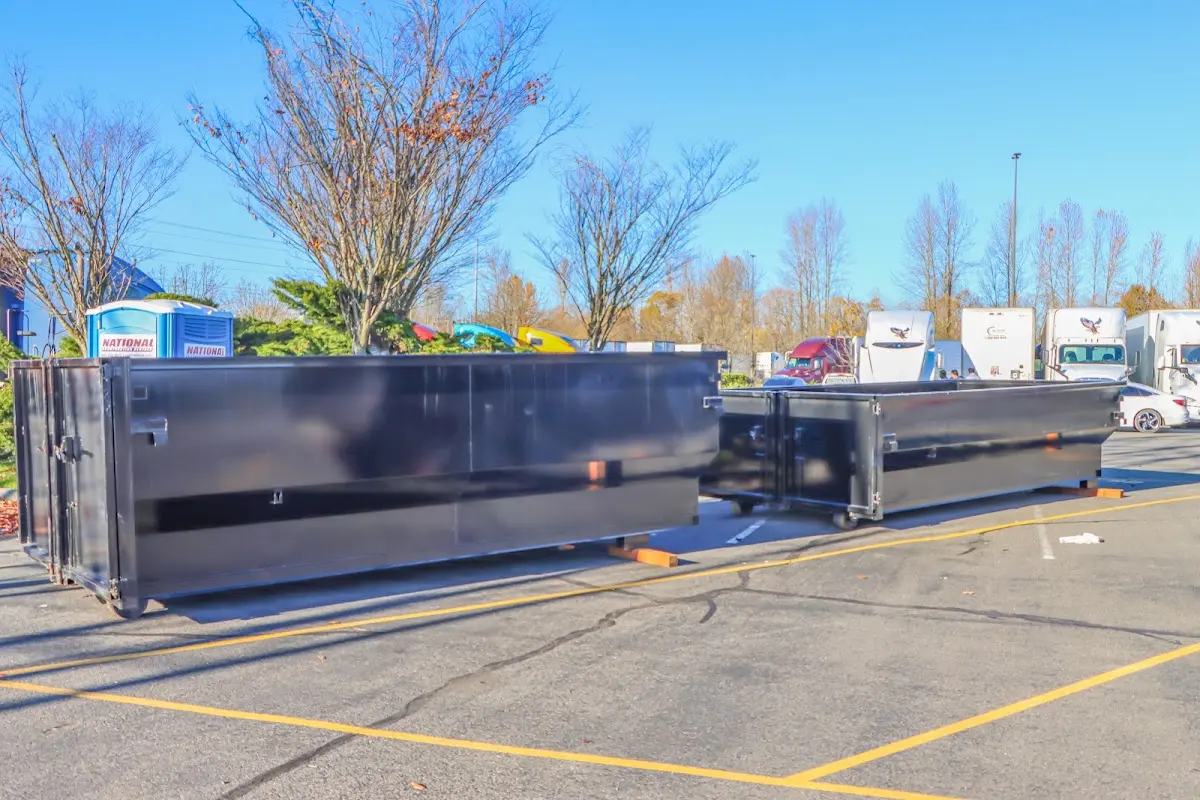 Professional dumpster rental service with roll-off container on residential driveway in Medical Lake